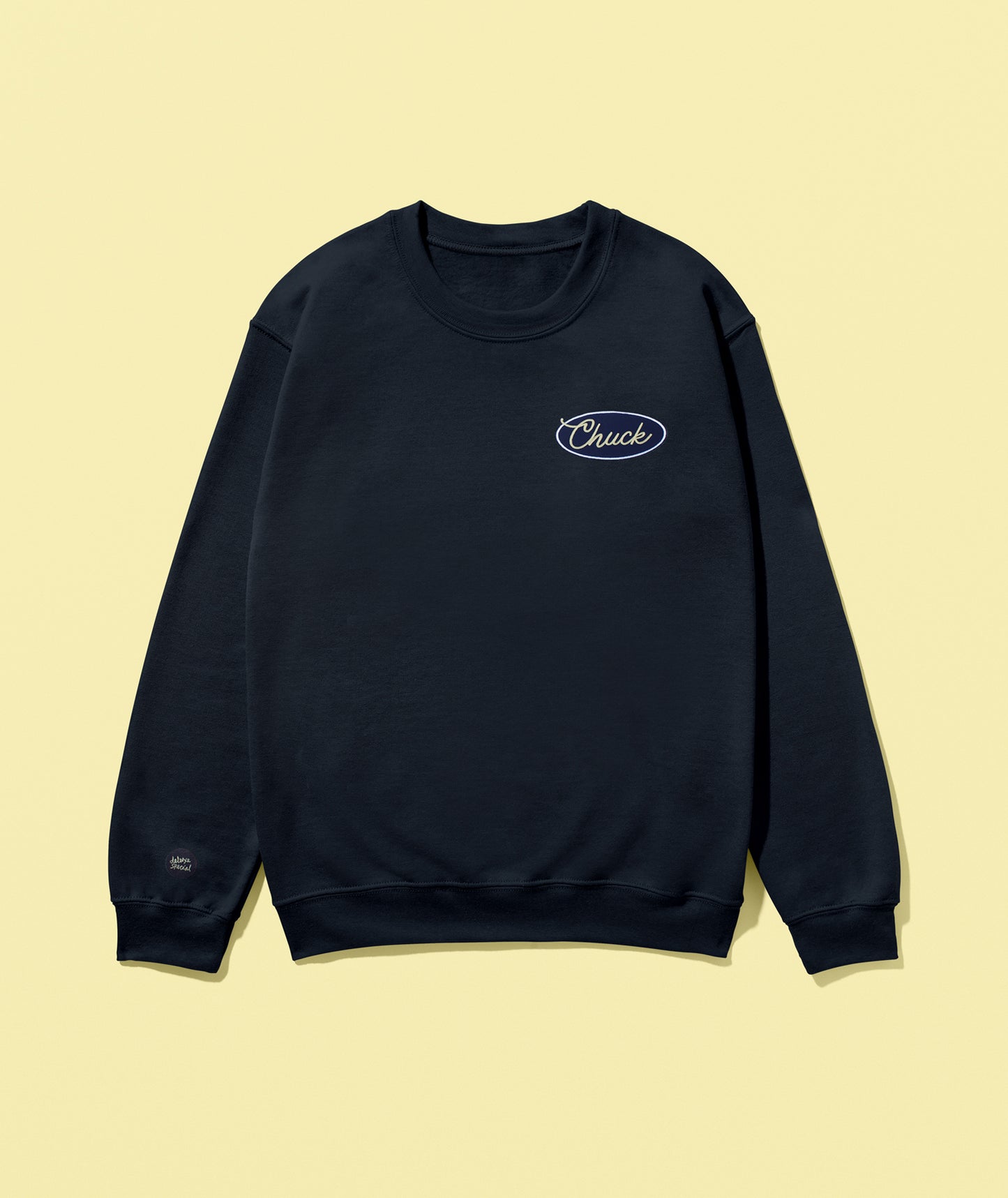 A navy-colored crewneck sweatshirt with 'Chuck' brand embroidery on the chest.