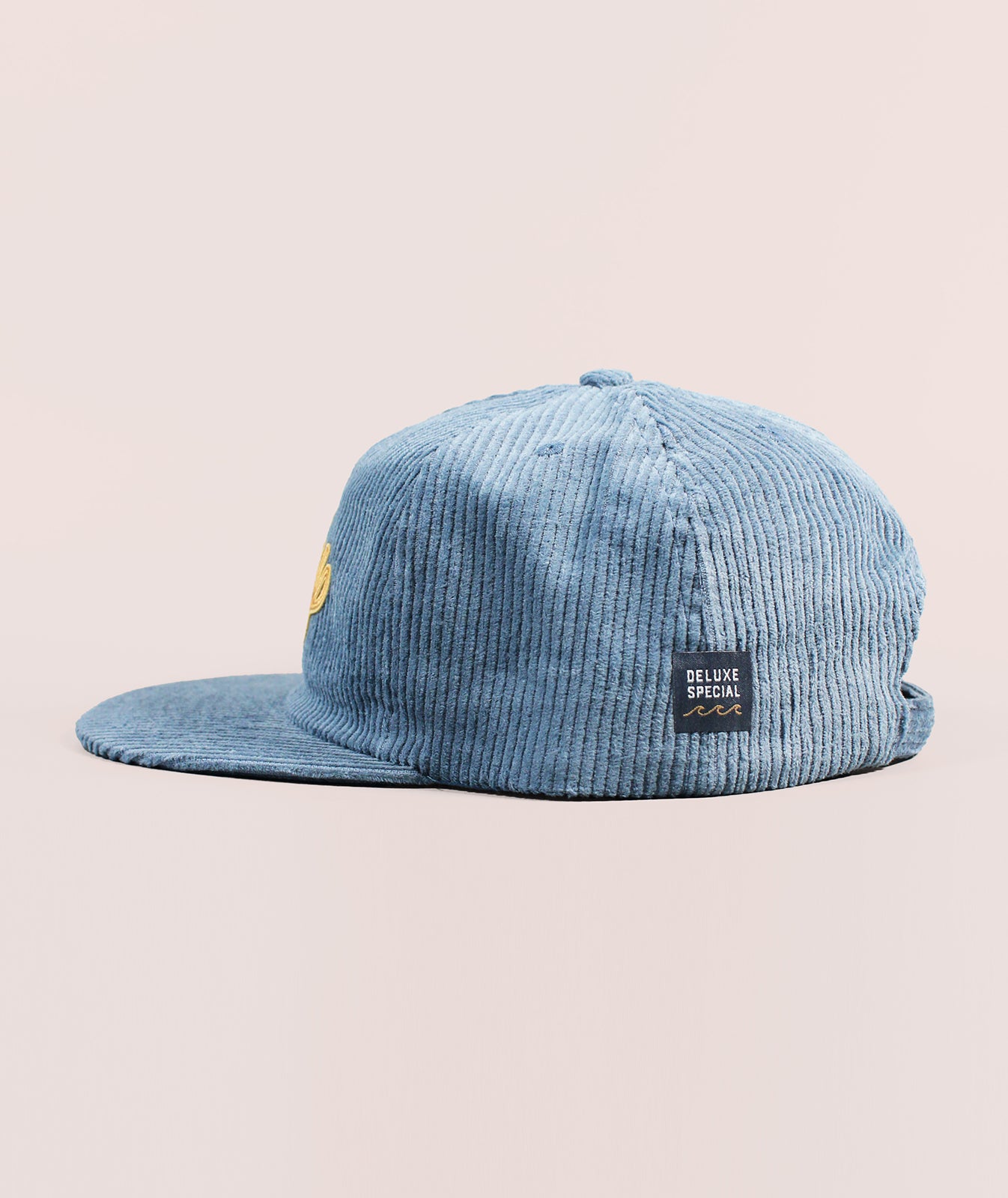 Blue corduroy hat from the side with Deluxe Special patch