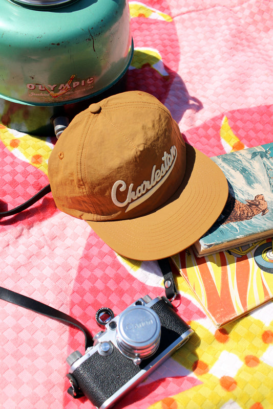 Gold cap with 'Charleston' text