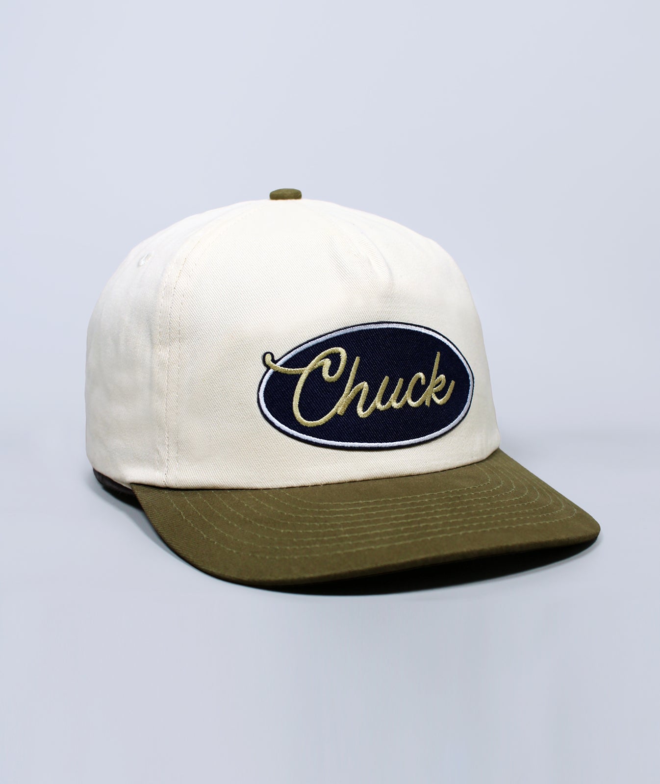 Charleston hat. Cap with 'Chuck' logo on a light gray background