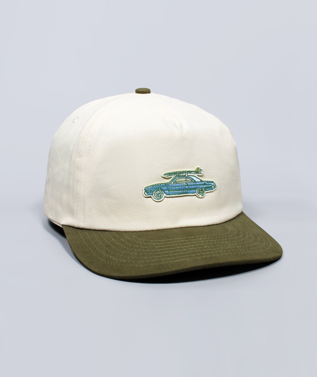 Cap with embroidered design on a light gray background