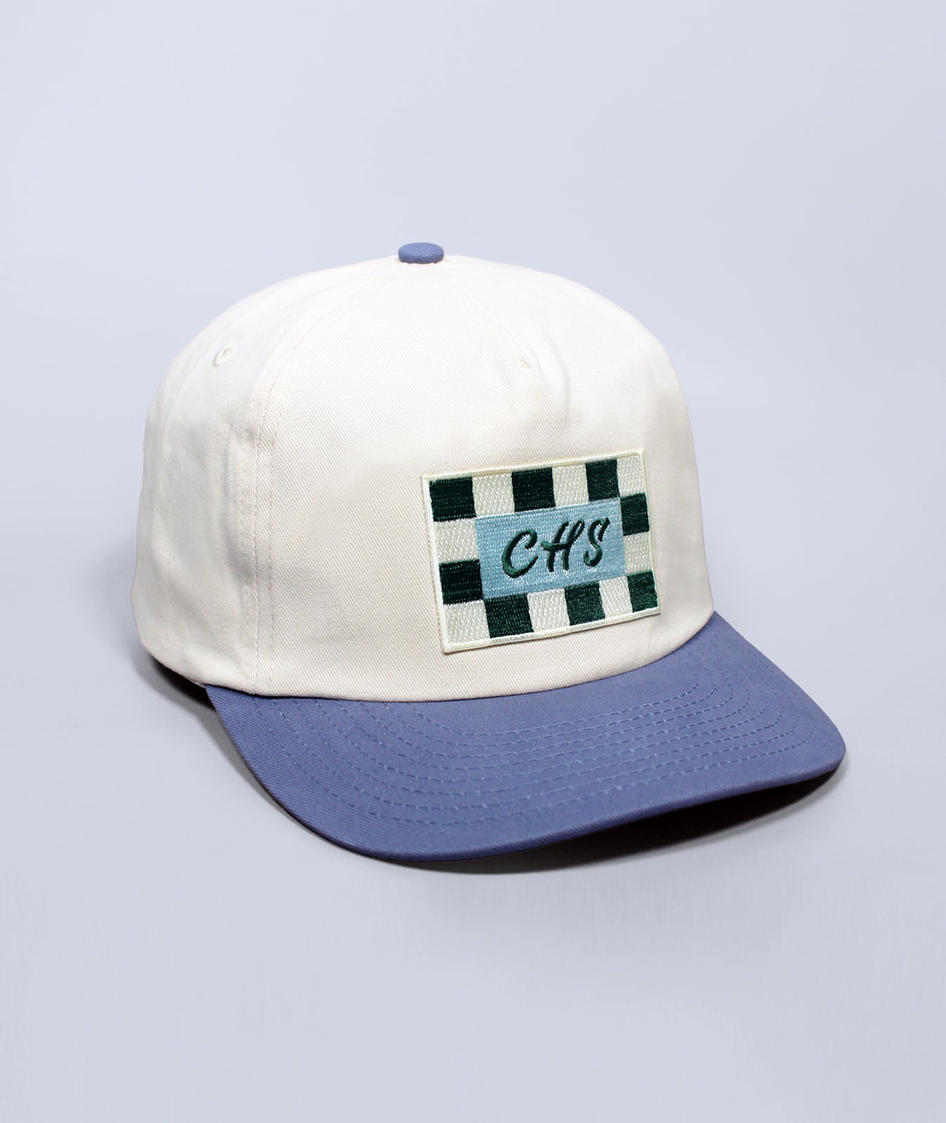 Cap with a checkered patch and 'CHS' text on a light gray background