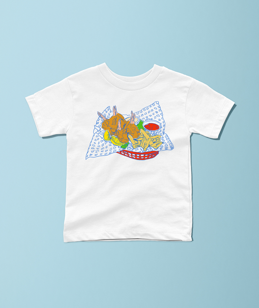 A white short-sleeve crewneck t-shirt featuring a colorful cartoon graphic of a french fry basket with shrimp and dipping sauce, displayed flat against a light blue background.