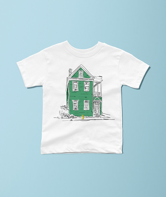 A white short-sleeve crewneck t-shirt featuring a graphic illustration of a green house with black sketch lines, displayed flat against a light blue background.