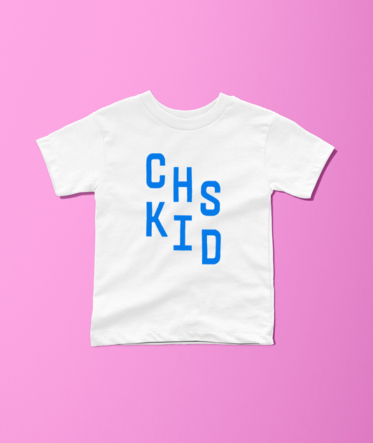 A white short-sleeve t-shirt with the text 'CHS KID' printed in blue block letters on the front, displayed flat against a solid pink background.
