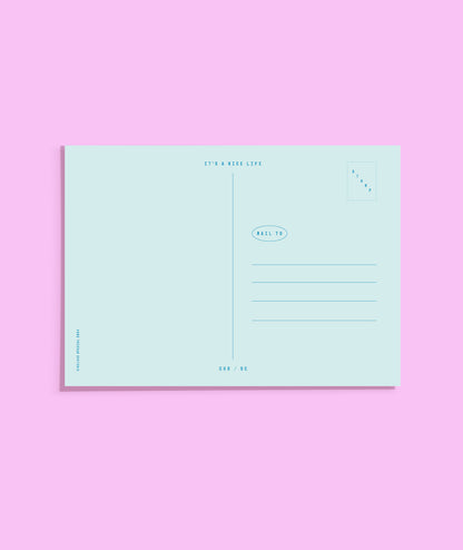 Light blue postcard on a pink background