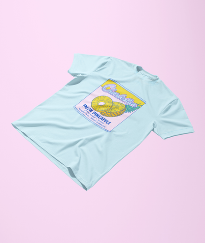 Light blue t-shirt with a pineapple graphic on a pink background