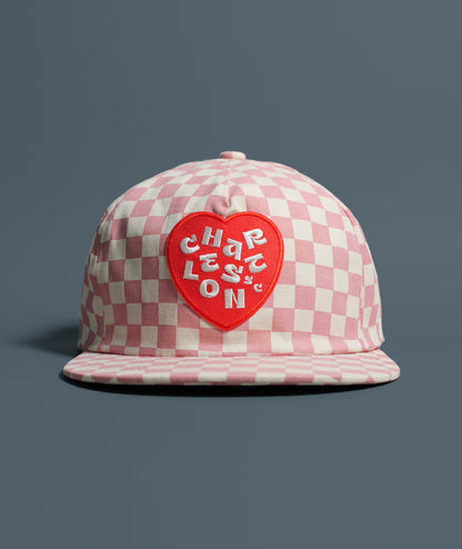 Pink and white checkered hat with red heart Charleston patch