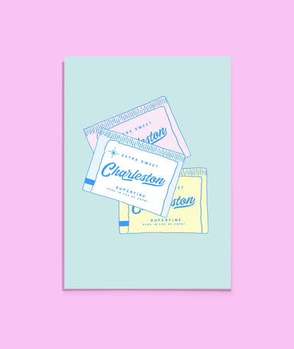 Packaging of Charleston sugar packets on a light blue card with a pink background